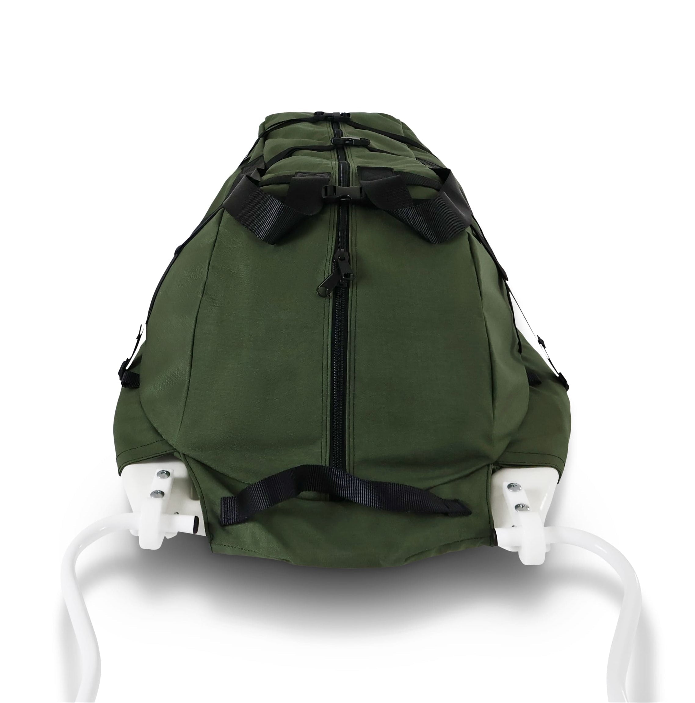 A Olive Green snowmobile Sled Pulk cargo bag with black straps and a white plastic base, shown on a white studio background. With a tag labeled 'Wilderness Engineering'.