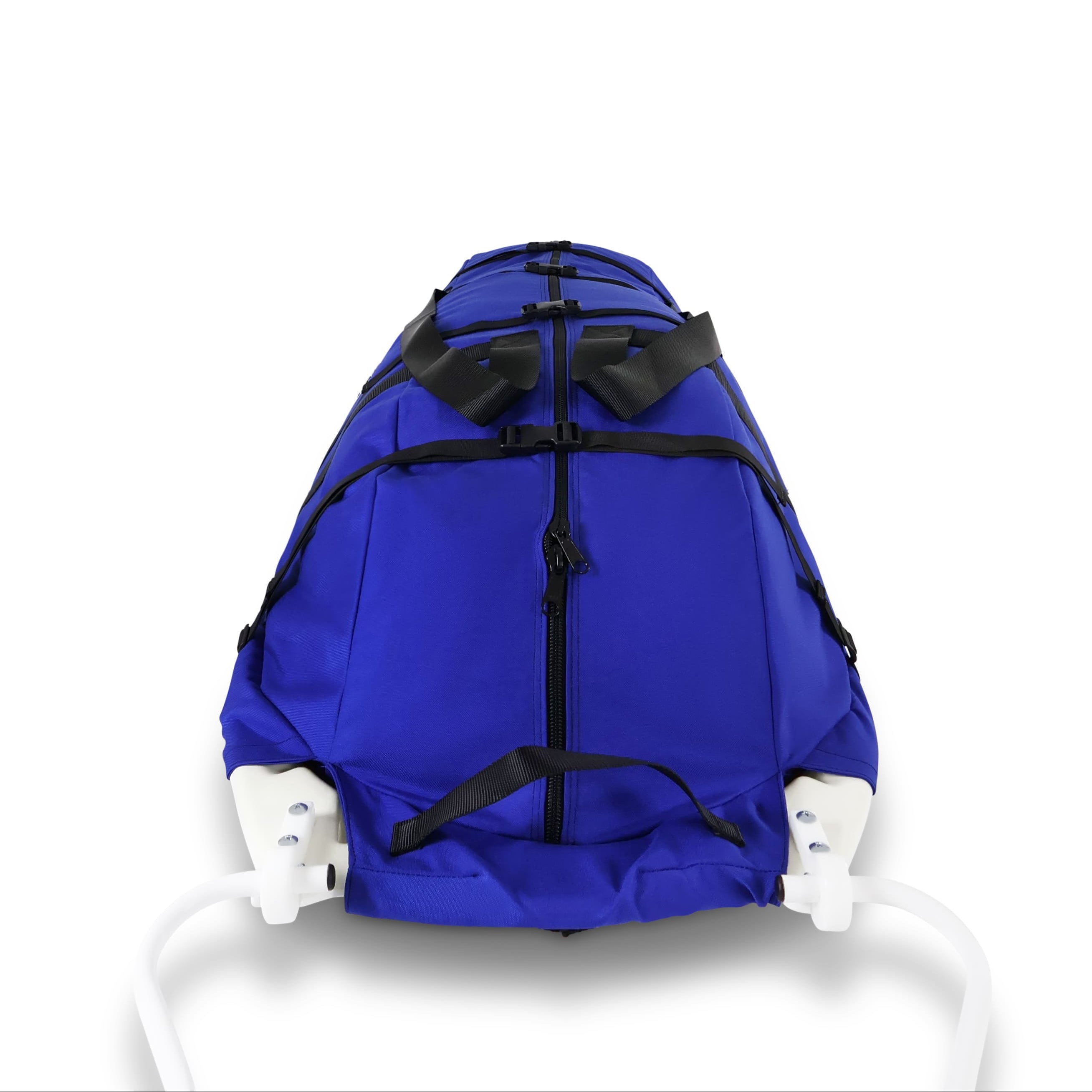 A blue snowmobile pulk sled cargo bag with black straps and a white plastic sled base, shown on a clean white background. A black label on the front displays the brand 'Wilderness Engineering'.
