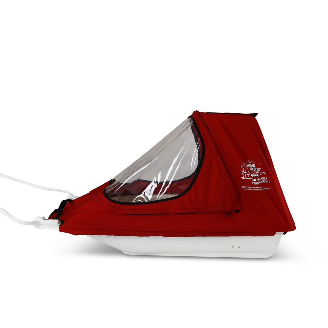 A red KinderShuttle Pulk canopy with a clear plastic window, shown on a white sled against a plain white background.